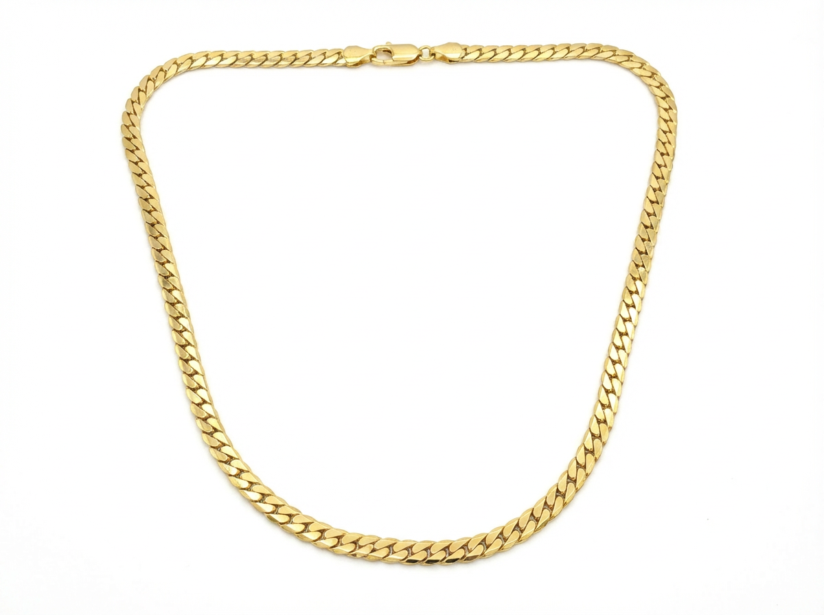 Gold chain necklace on a white background