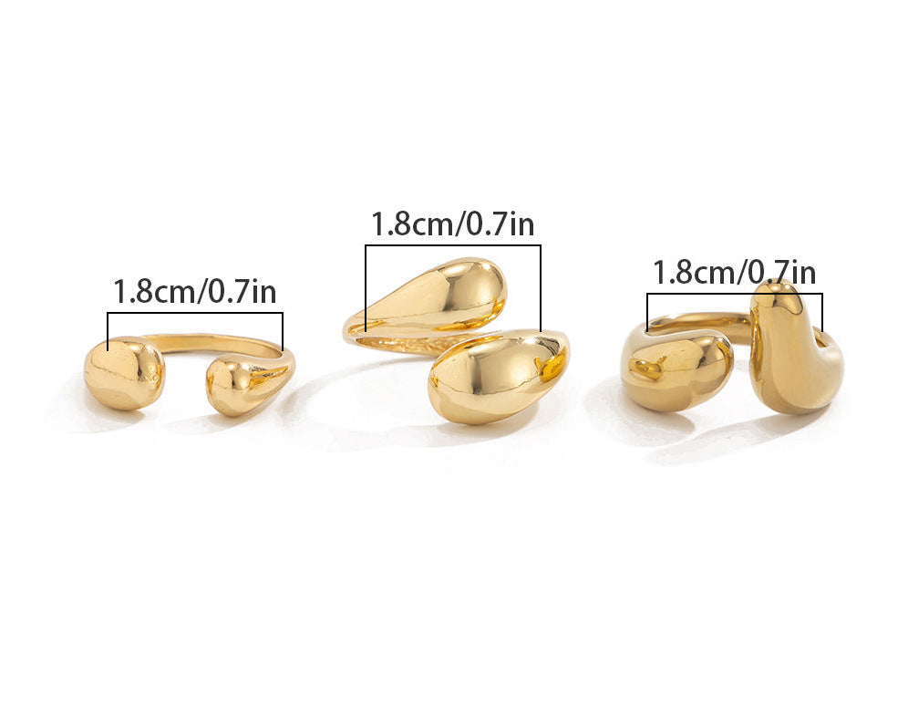 Gold rings with measurements and weight information on a white background