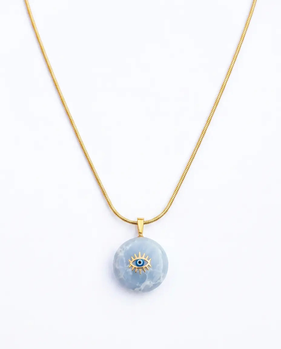 Necklace with a blue pendant featuring an eye design on a white background